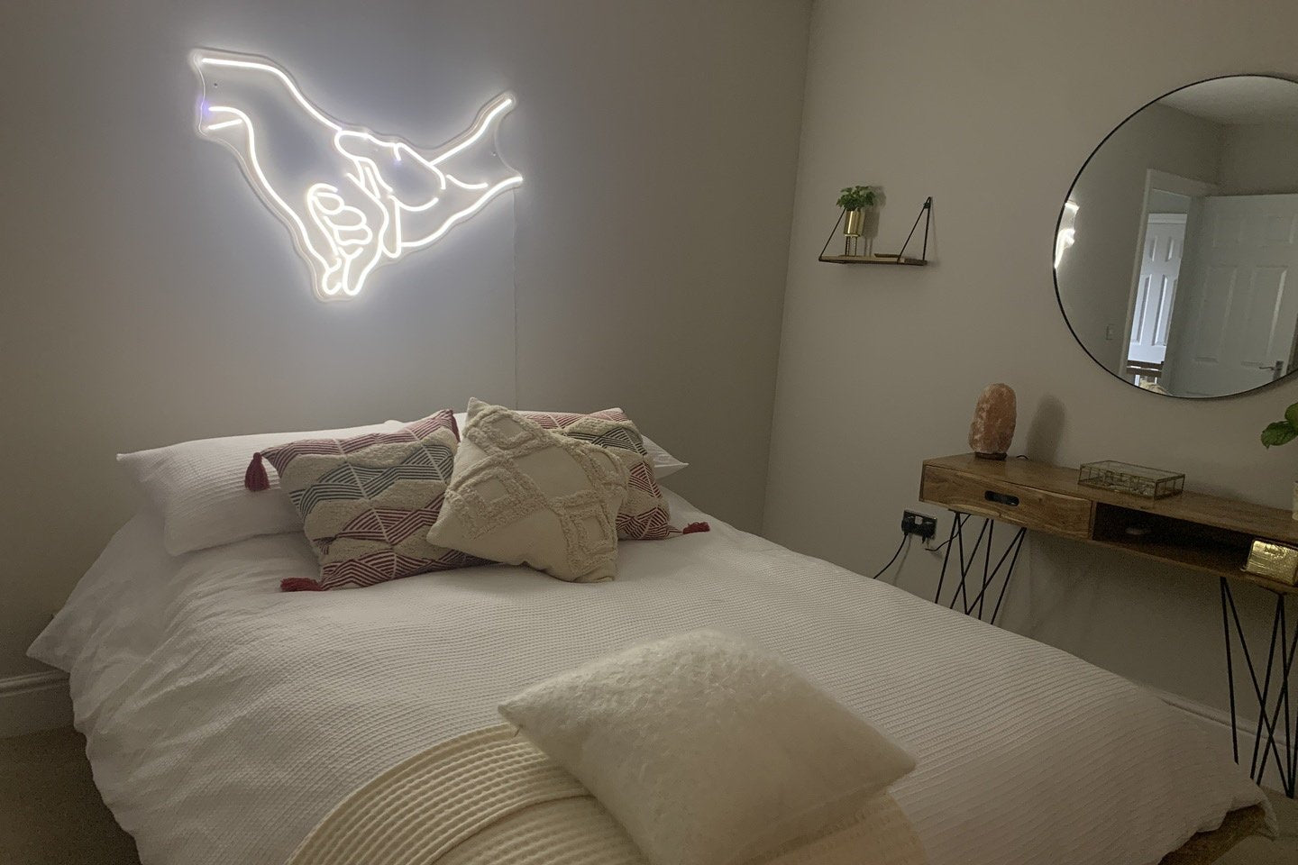 'Hand in hand' neon sign