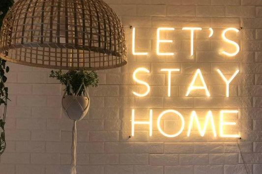 'LET'S STAY HOME' neon sign